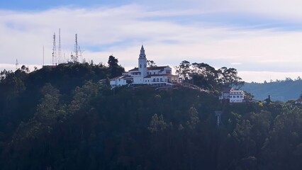 Monserrate Sanctuary In Bogota Cundinamarca Colombia. Stunning Baroque Church Contrasts With The Landscape . Nature Sky Clouds Sky Forest. Sky Rural Panoramic View. Bogota Cundinamarca.