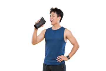 A man in fitness attire drinking from a black bottle
