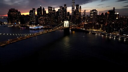 Obraz premium Brooklyn Bridge In Manhattan New York United States. Traffic Is Moving Across A Modern Cable-Stayed Bridge. Sunset Sky Clouds Downtown Cityscape. Sunset Outdoors Famous. Manhattan New York.