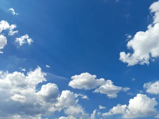 small white clouds photo of slightly cloudy blue sky © Kenan Sonmez 