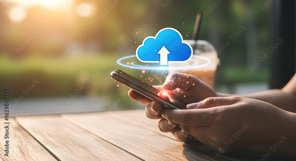 Poster hands holding smartphone with cloud upload graphic on table soft background