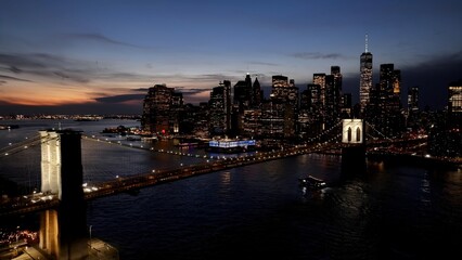 Fototapeta premium Sunset Brooklyn Bridge In Manhattan New York United States. Stunning Landscape Of Highway Road Viewed From Above. Building Town Sky Clouds Illumination Downtown Panoramic. Manhattan New York.