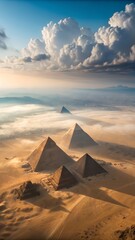 Majestic aerial view of the great pyramids of giza surrounded by desert and clouds