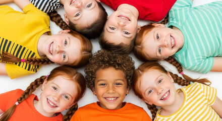 A diverse group of happy children lying in a circle, smiling and laughing together, showcasing friendship, unity, and the joy of childhood