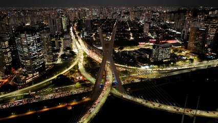 Night Cable Stayed Bridge In Downtown Sao Paulo Brazil. Breathtaking Aerial View Of Time Lapse Drone Footage. Building Town Sky Illuminated Urban. Illuminated Landmark. Downtown Sao Paulo.