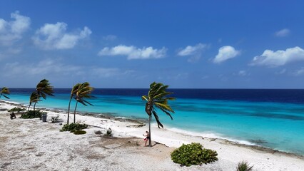 Pink Beach In Kralendijk Bonaire Netherlands Antilles. Turquoise Water Caresses Tropical Beach In A Caribbean. Shore Clouds Sky Beach Sea. Shore Travel. Kralendijk Bonaire.
