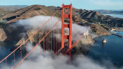 Golden Gate Bridge Aerial In San Francisco California United States. Traffic Is Moving Across A Modern Cable-Stayed Bridge. Infrastructure Landscape Company Building Stunning. © bydronevideos