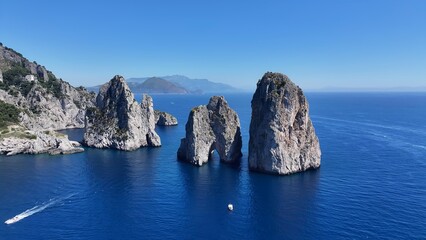 Faraglioni Rocks In Capri Naples Italy. Turquoise Ocean Waves Gently Crashing On Tropical Beach. Deserted Skyline Idyllic Beauty. Deserted Waterfront Shore. Capri Naples.