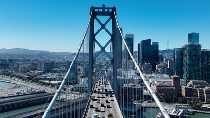 Obraz premium Oakland Bay Bridge In Oakland California United States. Traffic Is Moving Across A Modern Cable-Stayed Bridge. Metropole Landscape Company Building Vibrant. Metropole Corporate Town.