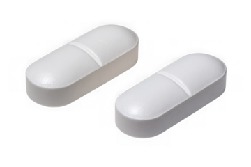 Two white oval pills with a score line isolated on transparent background