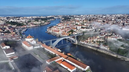 Obraz premium Luis I Bridge In Porto Portugal. City Skyline Showing Modern And Traditional Architecture. Business Sky Downtown Cityscape. Business Panning Wide. Porto Portugal.