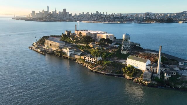 Sunset Alcatraz Island In San Francisco California United States. Aerial View Of A Bustling City With High-Rise Buildings And Traffic. Building Metropole Skyline Bird View Awesome.