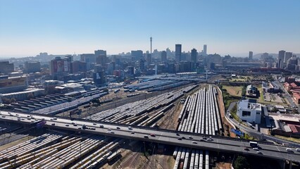 Obraz premium Johannesburg Skyline In Johannesburg Gauteng South Africa. Aerial View Of A High-Rise Buildings And Traffic Showcasing Urban Life. Infrastructure Landscape Company Building Stunning.