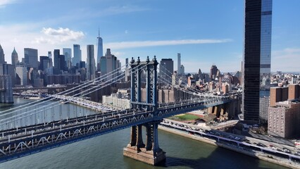 Obraz premium Manhattan Bridge In Manhattan New York United States. Traffic Is Moving Across A Modern Cable-Stayed Bridge. Metropolitan Landscape High Rise Building Amazing. Metropolitan Town. Manhattan New York.