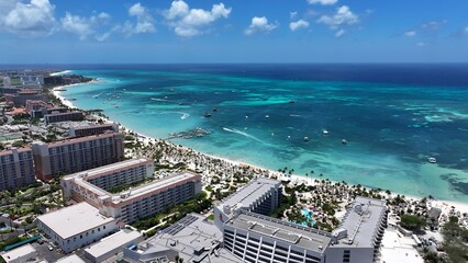 High Rise Hotels In Palm Beach Oranjestad Aruba. Aerial View Of A High-Rise Buildings And Traffic Showcasing Urban Life. Shore Horizon Beach Sea. Shore Seaside Tropical Environment.