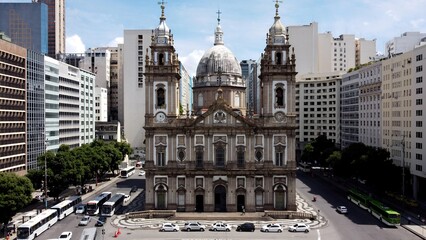 Naklejka premium Candelaria Church In Rio De Janeiro Brazil. Bird Eye View Of Church Standing Tall Amidst Beautiful Scenery. Town Sky Clouds Backgrounds Urban. Town Panorama. Rio de Janeiro Brazil.