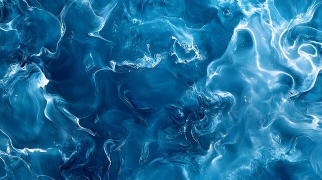 Photograph of abstract marble texture, dark blue with white swirling patterns creates a dynamic and fluid effect.