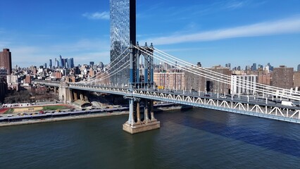 Manhattan Bridge In Manhattan New York United States. Traffic Is Moving Across A Modern Cable-Stayed Bridge. Metropolitan Landscape Commercial Building Amazing. Commercial Building.