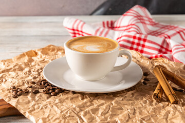 Warm Coffee Cup Resting on Rustic Table Setting