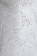 Crumpled white paper background.