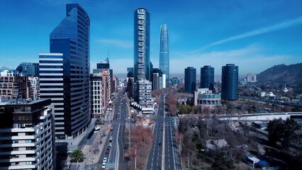 Obraz premium Santiago Skyline In Santiago Chile. Aerial View Of A High-Rise Buildings And Traffic Showcasing Urban Life. Infrastructure Landscape Company Building Stunning. Infrastructure Urban. Santiago Chile.
