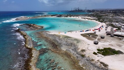 Fototapeta premium Baby Beach In San Nicolas Oranjestad Aruba. Birds Eye View Of Stunning Caribbean Beach Scenery. Coast Clouds Seaside Summertime. Outdoors Seaside Scenic Coastline. San Nicolas Oranjestad.