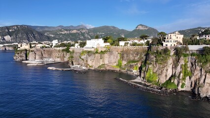 Obraz premium Sorrento Skyline In Naples Campania Italy. Turquoise Ocean Waves Gently Crashing On Tropical Beach. Shore Sky Clouds Beach Sea. Seaside Panorama. Naples Campania.