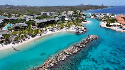 Obraz premium Beach Resort In Willemstad Netherlands Curacao. Capturing The Beauty Of A Tropical Beach From Above. Shore Clouds Sky Beach Sea. Shore Travel. Willemstad Netherlands.