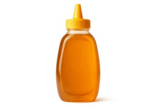 Honey bottle with yellow cap on transparent background