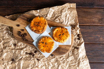 Delicious Cheese Pastries on a Rustic Wooden Board