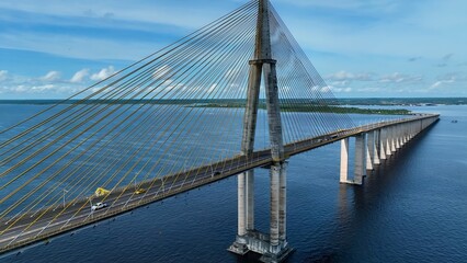 Suspension Cable Bridge In Manaus Amazonas Brazil. Birds Eye View Of Suspension Bridge With Cars Driving Across. Shore Clouds Sky Beach Sea. Shore Beach Scenic Coastline. Manaus Amazonas.