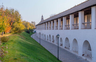 historic wall tower at Astrakhan Kremlin in the Russian Volga region, with cobblestone paths and...