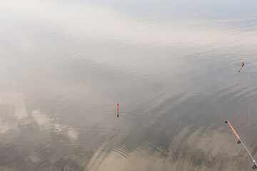 floats on the surface of the reservoir and the reflection of the sky on the surface of the water