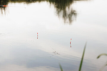 floats on the surface of the reservoir and the reflection of the sky on the surface of the water
