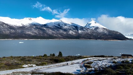 Flamingos Flying In El Calafate Patagonia Argentina. Flock Of Pink Flamingos Flying Over Scenic Lagoon Water. Outdoor Travel Destinations Patagonia Glacier. Outdoor Snow Covered Above View.