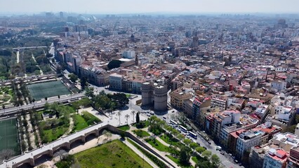 Fototapeta premium Serranos Towers In Valencia Spain. Birds Eye View Of Stunning Cityscape With Streets And Buildings. Business Sky Downtown Cityscape. Business Panning Wide. Valencia Spain.