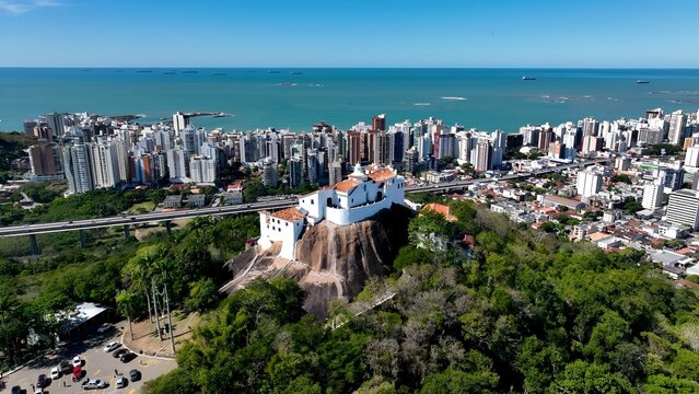 Penha Convent In Vitoria Espirito Santo Brazil. Aerial View Of A Bustling Downtown Cityscape With Modern Buildings. Town Clouds Sky Backgrounds Urban. Backgrounds Downtown Panoramic City.