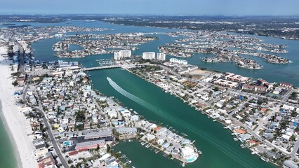 Fototapeta premium St. Pete Beach In Saint Petersburg Florida United States. Aerial View Of A Bustling City With High-Rise Buildings And Traffic. Shore Clouds Sky Beach Sea. Shore Beach Scenic Coastline.