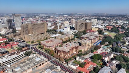 Obraz premium Johannesburg Skyline In Johannesburg Gauteng South Africa. Capturing The Hustle And Bustle Of A Vibrant City From Above. Infrastructure Landscape Company Building Stunning.