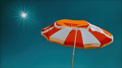Bright sun orange beach umbrella blue sky