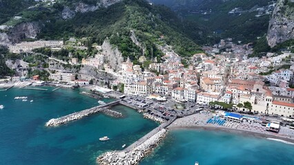 Fototapeta premium Amalfi Coast In Positano Salerno Italy. Aerial View Of A High-Rise Buildings And Traffic Showcasing Urban Life. Shore Horizon Beach Sea. Shore Seaside Tropical Environment. Positano Salerno.