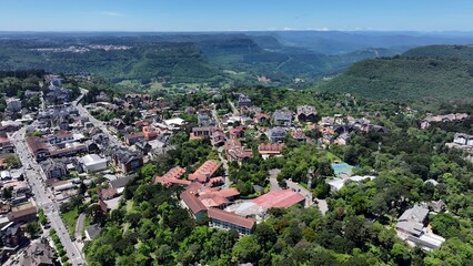 Obraz premium Gramado Skyline In Gramado Rio Grande Do Sul Brazil. Aerial View Of A High-Rise Buildings And Traffic Showcasing Urban Life. Town Sky Clouds Backgrounds Urban. Town Panorama.