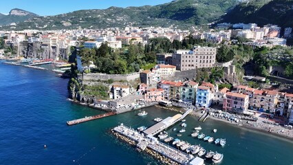 Fototapeta premium Sorrento Coast In Sorrento Naples Italy. Boat Sailing With Tourists Enjoying The Trip In A Sunny Day. Island Life Landscape Peaceful Beautiful. Island Life Watercolor Coast. Sorrento Naples.