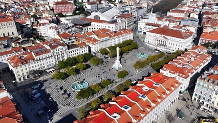 Naklejka premium Dom Pedro Iv Square In Lisbon Portugal. Drone Capturing The Beauty Square In The Center Of City. Industrial Landscape Buildings Stunning. Urban Buildings Town. Lisbon Portugal.
