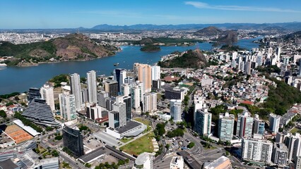 Obraz premium Downtown City In Vitoria Espirito Santo Brazil. Aerial View Of A High-Rise Buildings And Traffic Showcasing Urban Life. Business Sky Background Downtown Cityscape. Outdoor Downtown Panning Wide.