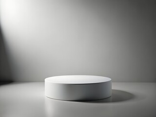 White round pedestal display in spotlight, minimalist studio background