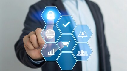 Businessman interacting with a futuristic digital interface displaying business icons