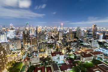 Aerial view of Sukhumvit district in Bangkok, Thailand, during sunset. The golden light bathes...