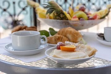 breakfast with coffee and croissant