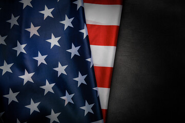American flag with stars and stripes on a dark textured background